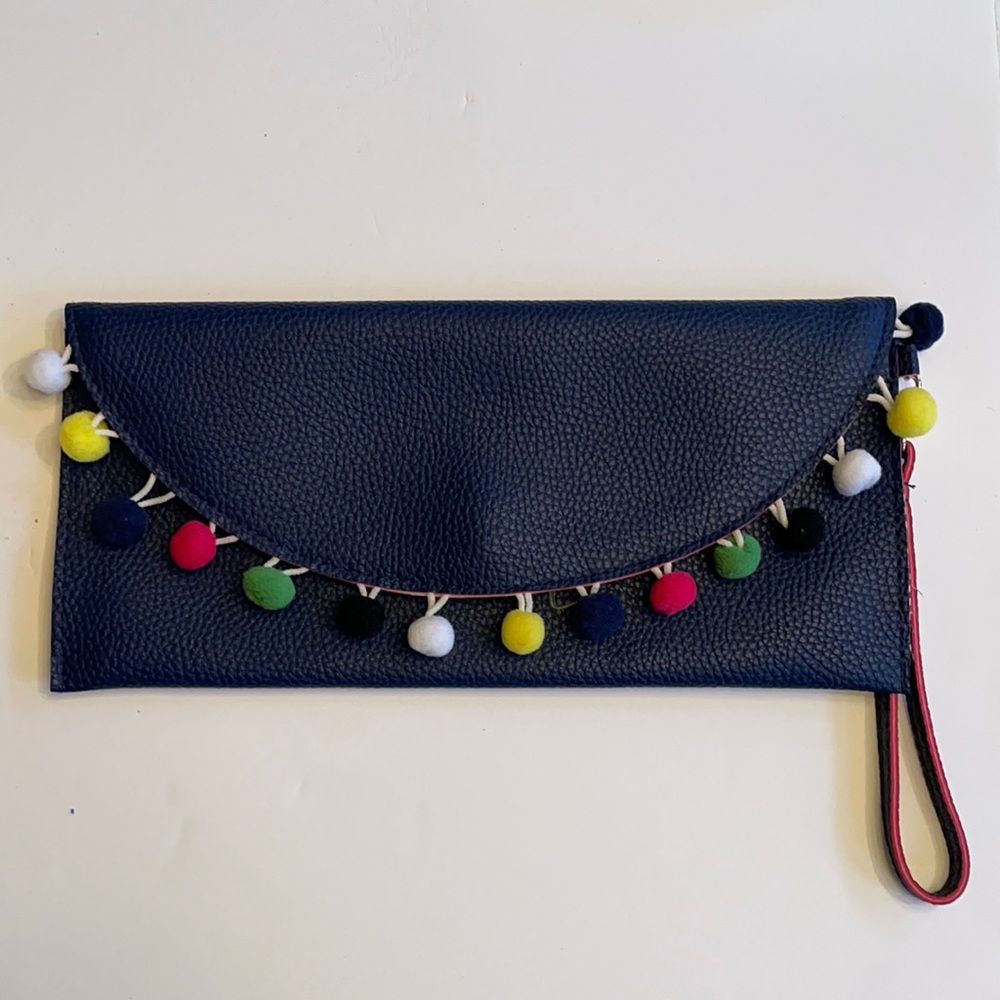 Blue vegan leather clutch with Pom Pom trim (NWOT)